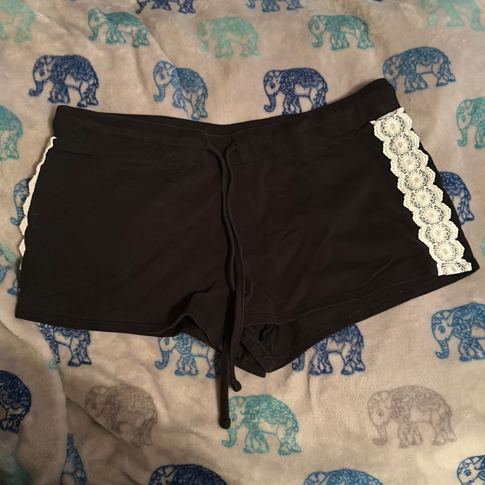Size medium shorts from Almost Famous. Black with cute lace design on the sides.